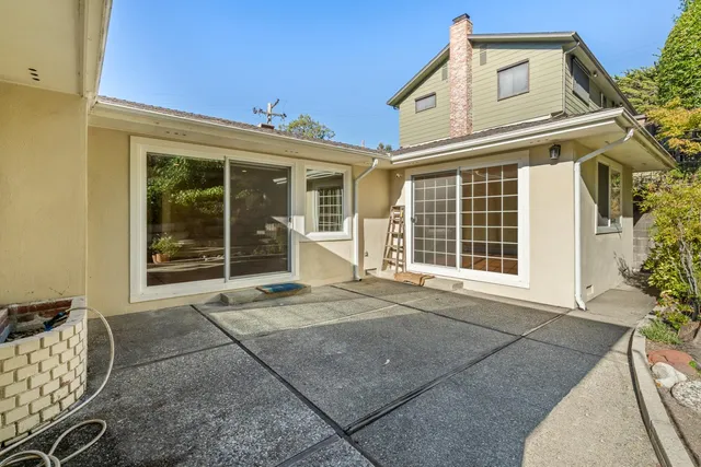 a front view of a house with outdoor space and sitting area