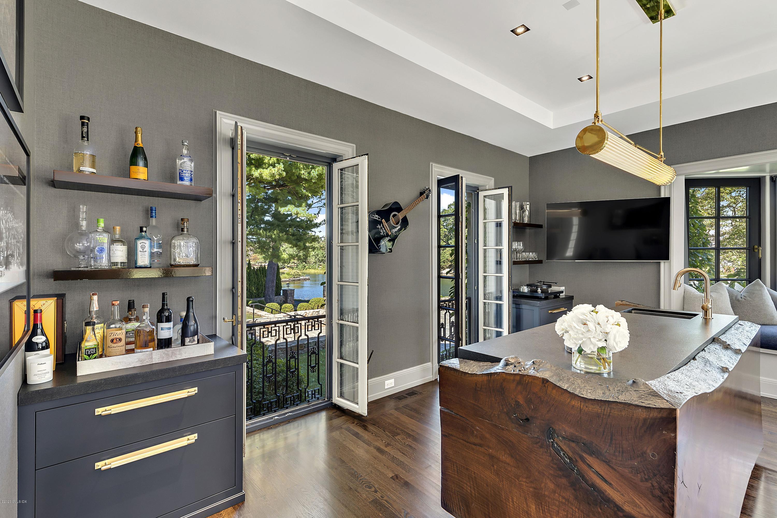 16 Chimney Corner Lane Greenwich, CT 06830 - Photo 13 of 39 a living room with furniture fireplace and flat screen tv