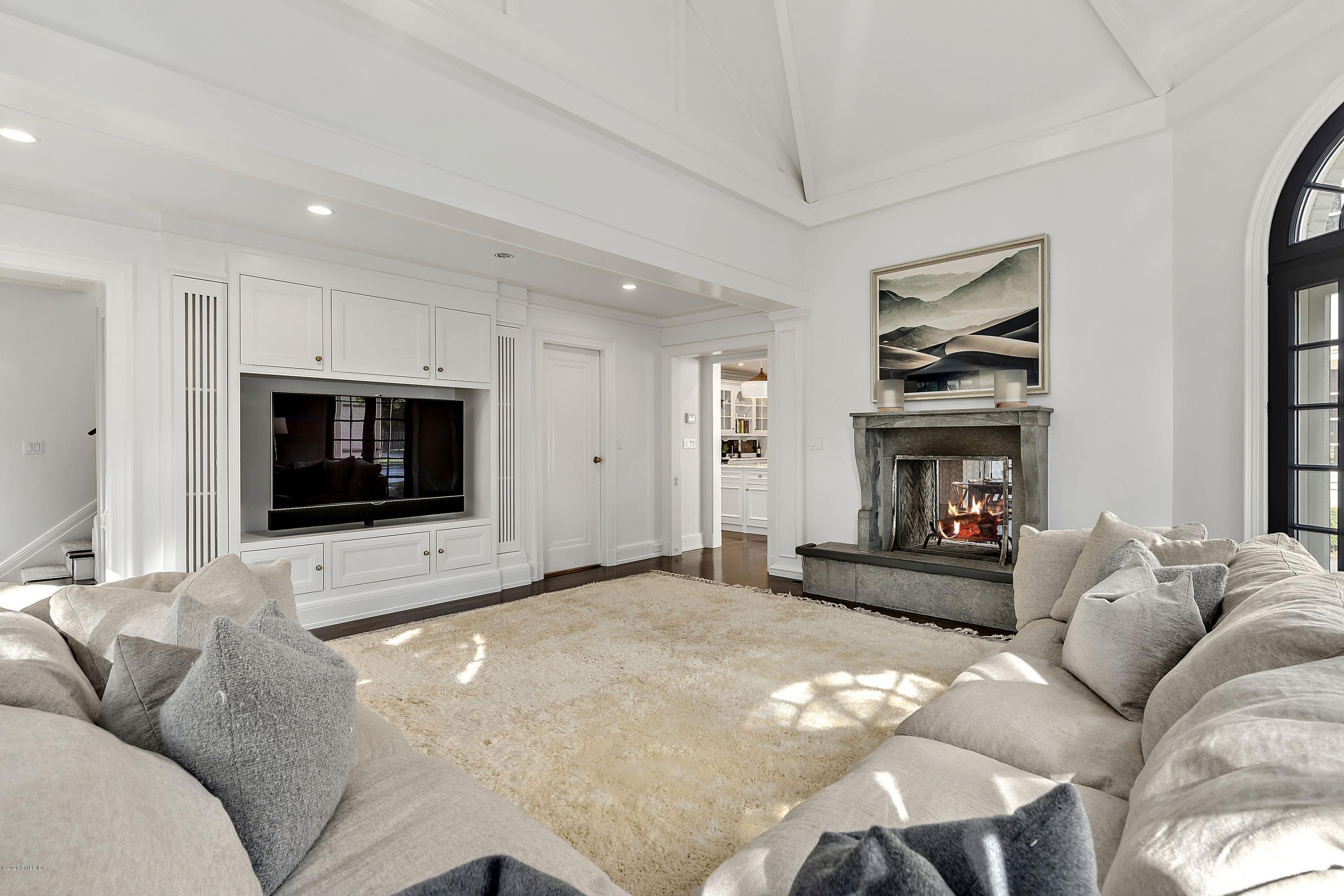 16 Chimney Corner Lane Greenwich, CT 06830 - Photo 22 of 39 a living room with furniture and a flat screen tv