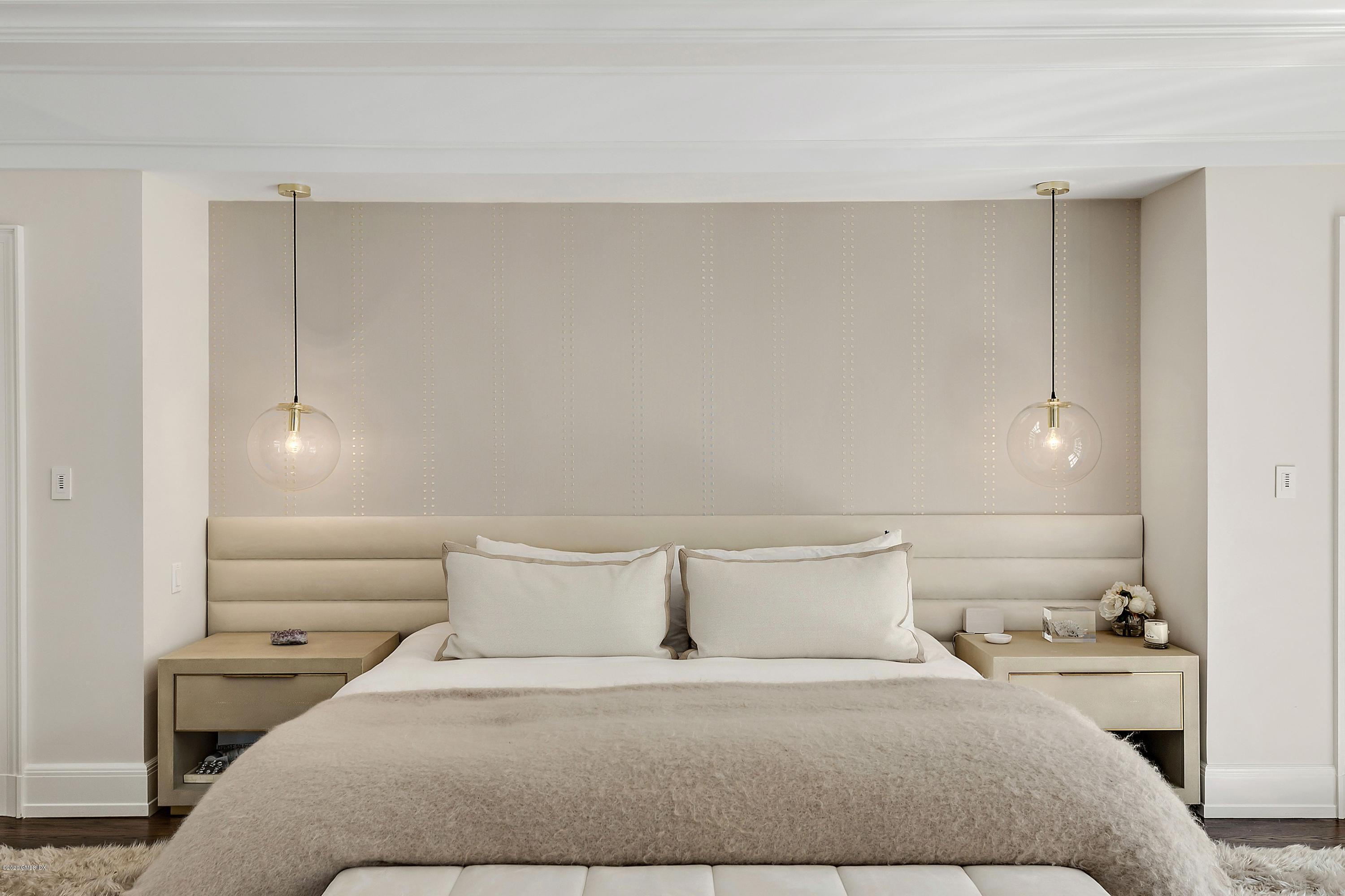 16 Chimney Corner Lane Greenwich, CT 06830 - Photo 25 of 39 a bedroom with a bed and a night stand