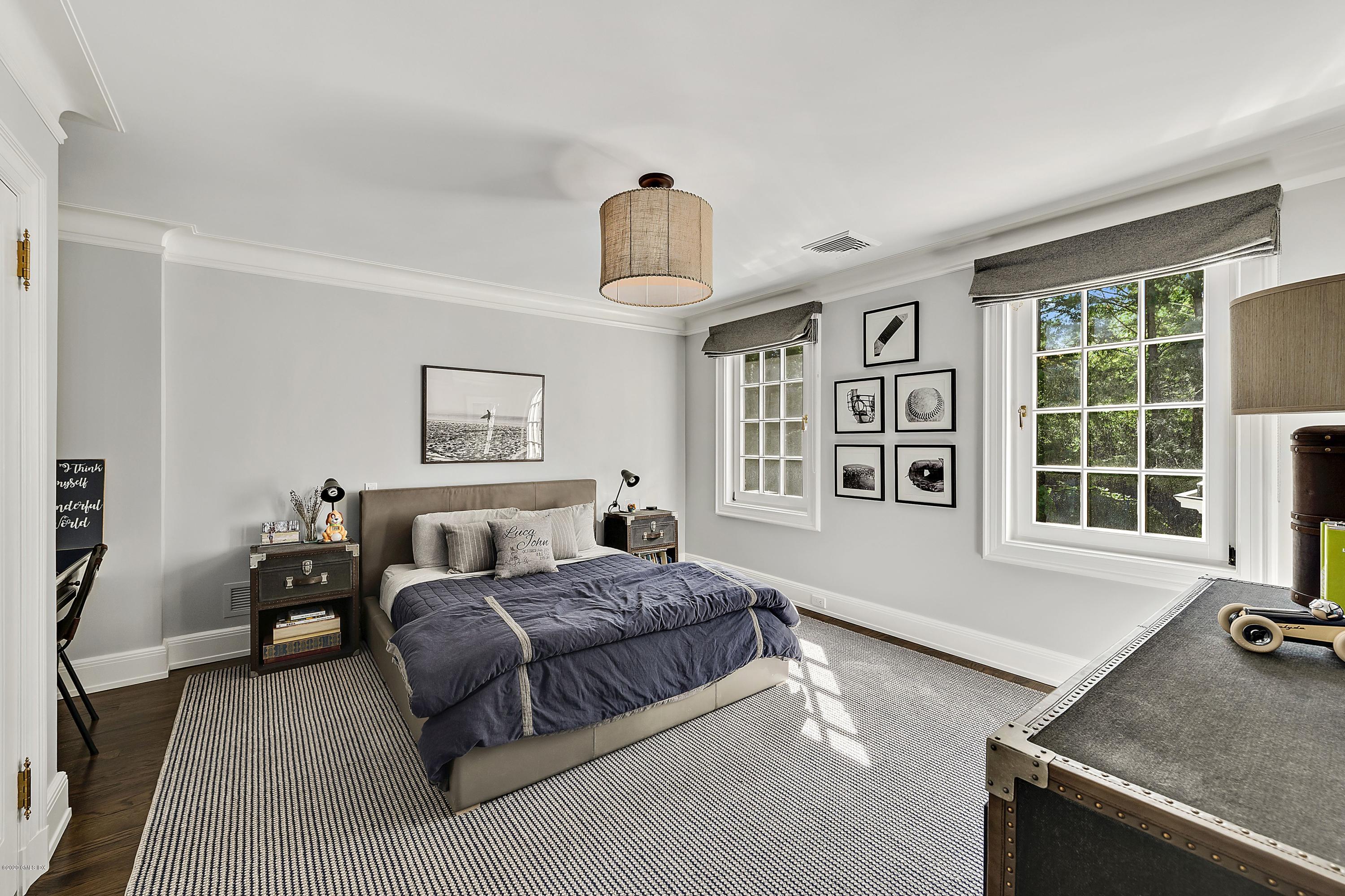 16 Chimney Corner Lane Greenwich, CT 06830 - Photo 28 of 39 a living room with a bed furniture and a window