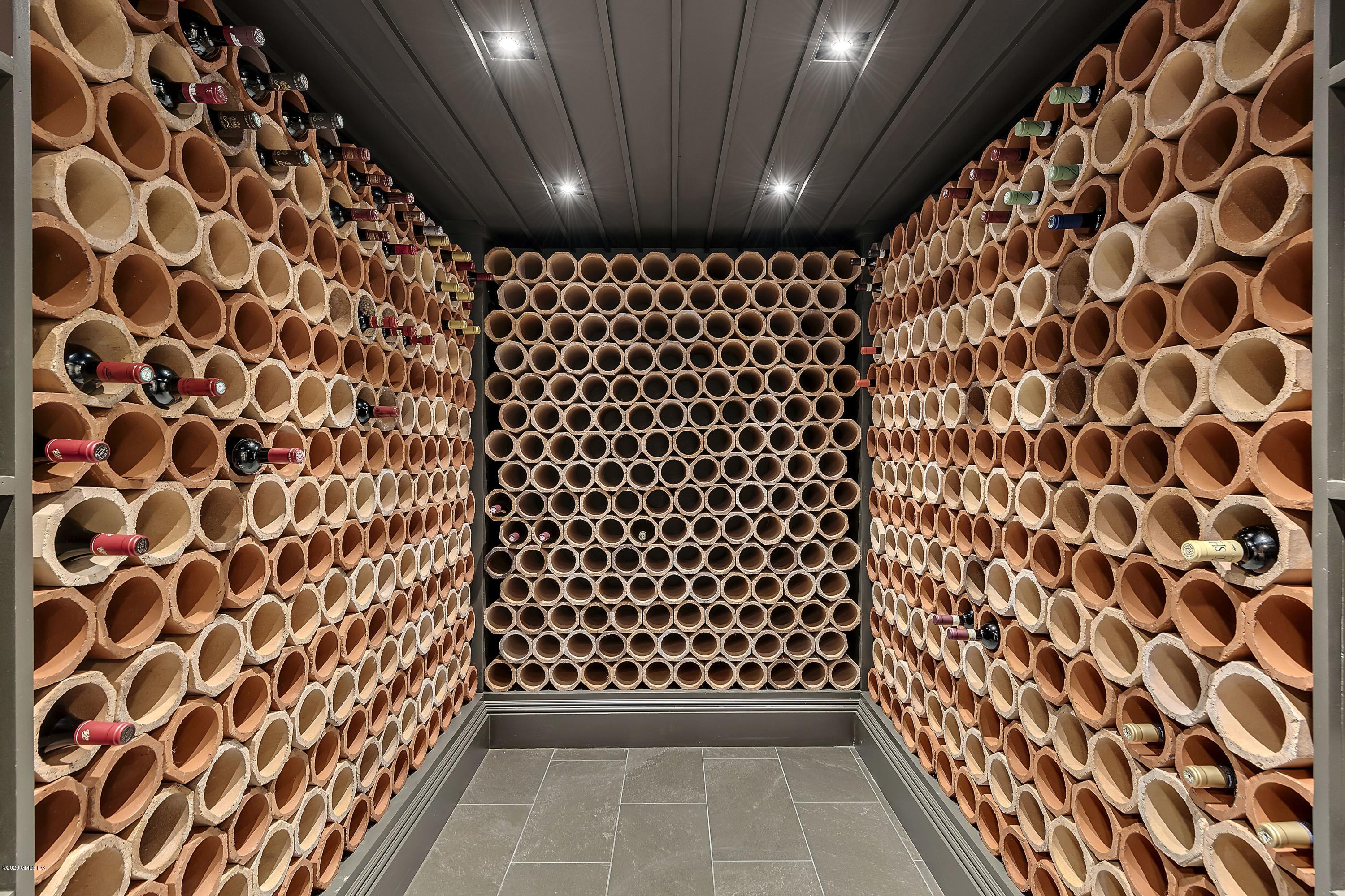 16 Chimney Corner Lane Greenwich, CT 06830 - Photo 32 of 39 a bathroom with a black and white checkered floor