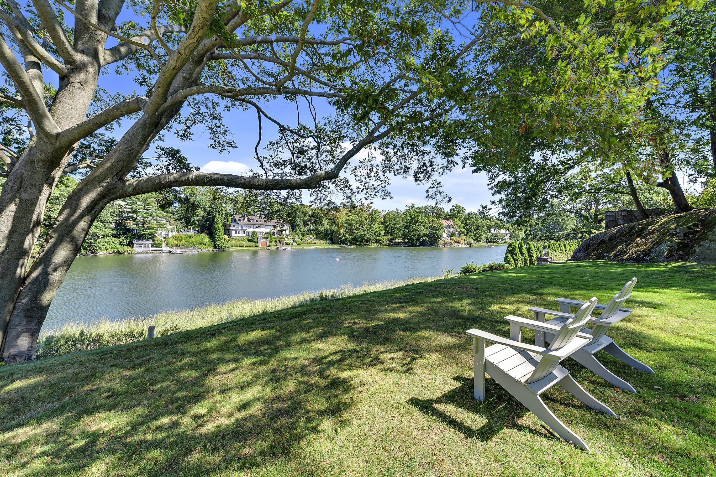 16 Chimney Corner Lane Greenwich, CT 06830 - Photo 38 of 39 a view of a lake with a yard