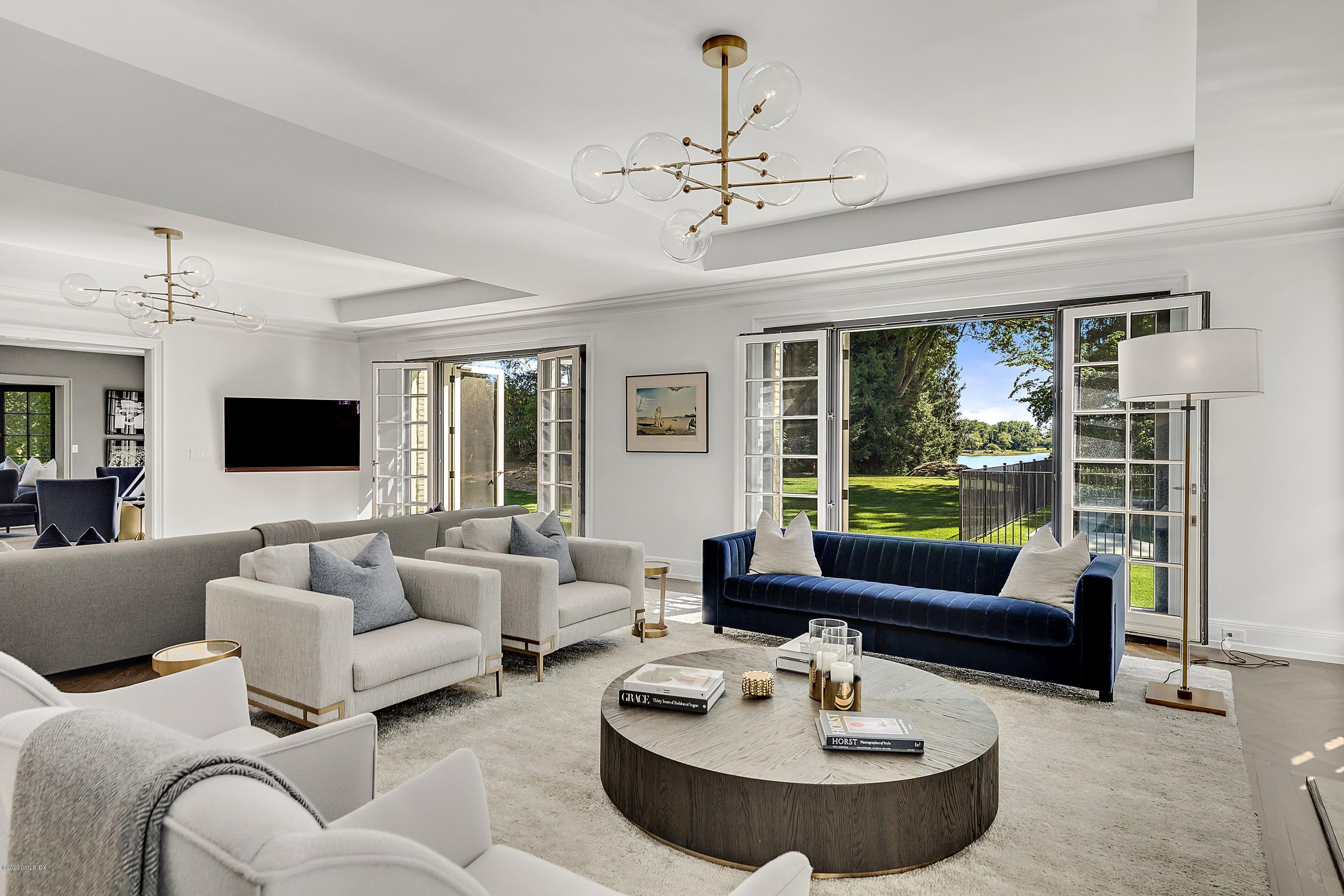 16 Chimney Corner Lane Greenwich, CT 06830 - Photo 8 of 39 a living room with furniture and a large window