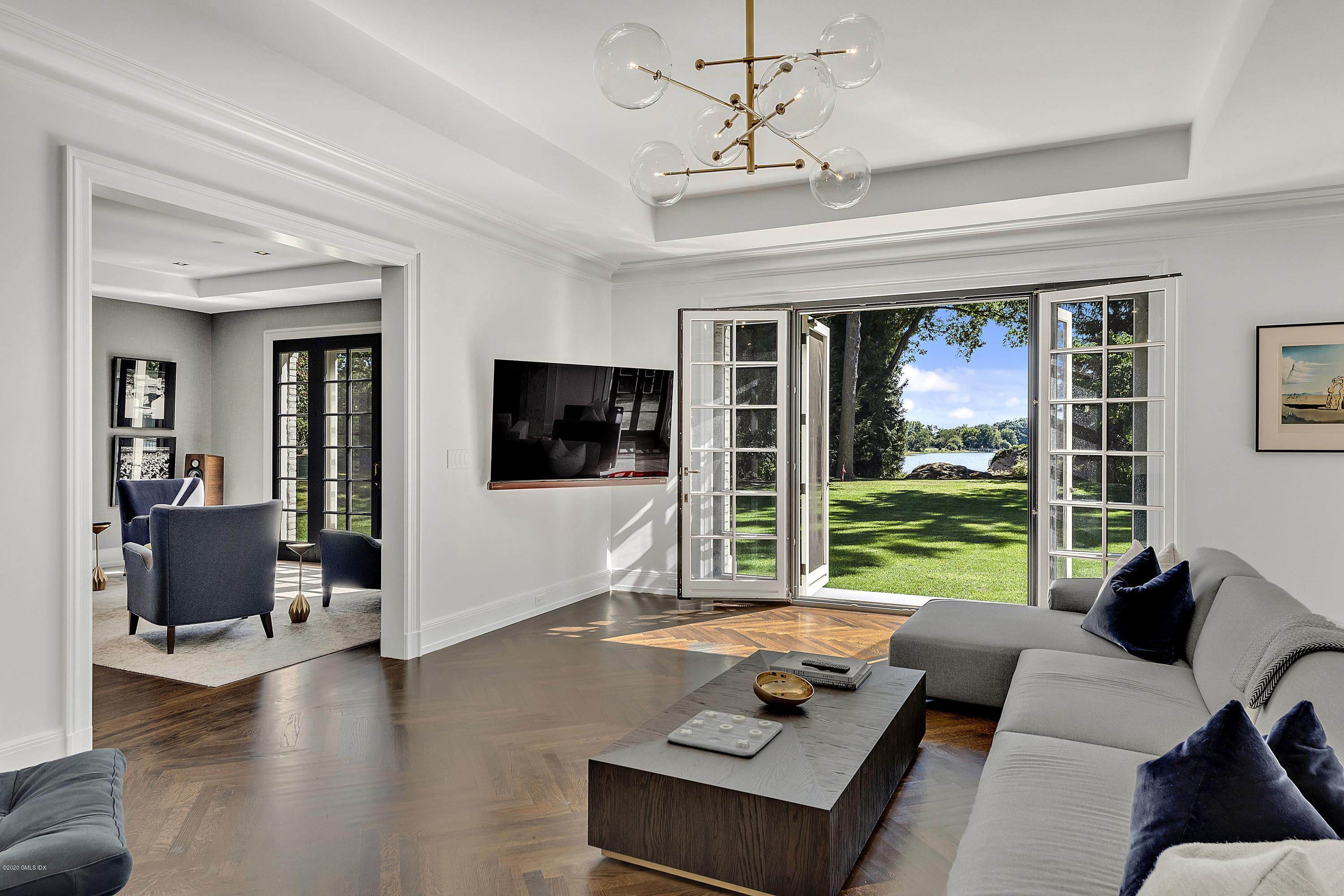 16 Chimney Corner Lane Greenwich, CT 06830 - Photo 9 of 39 a living room with furniture and a large window