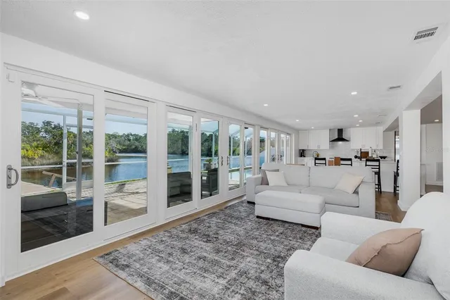 a bedroom with a large bed and a large window