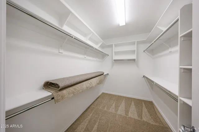 a view of an empty walk in closet