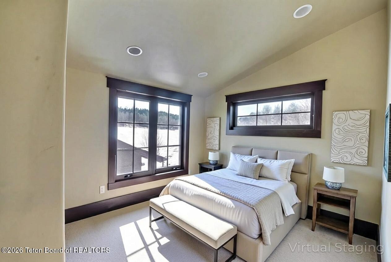 9802 Hiddenwaters Lane Victor, ID 83455 - Photo 26 of 52 Upper level bedroom - virtual staging