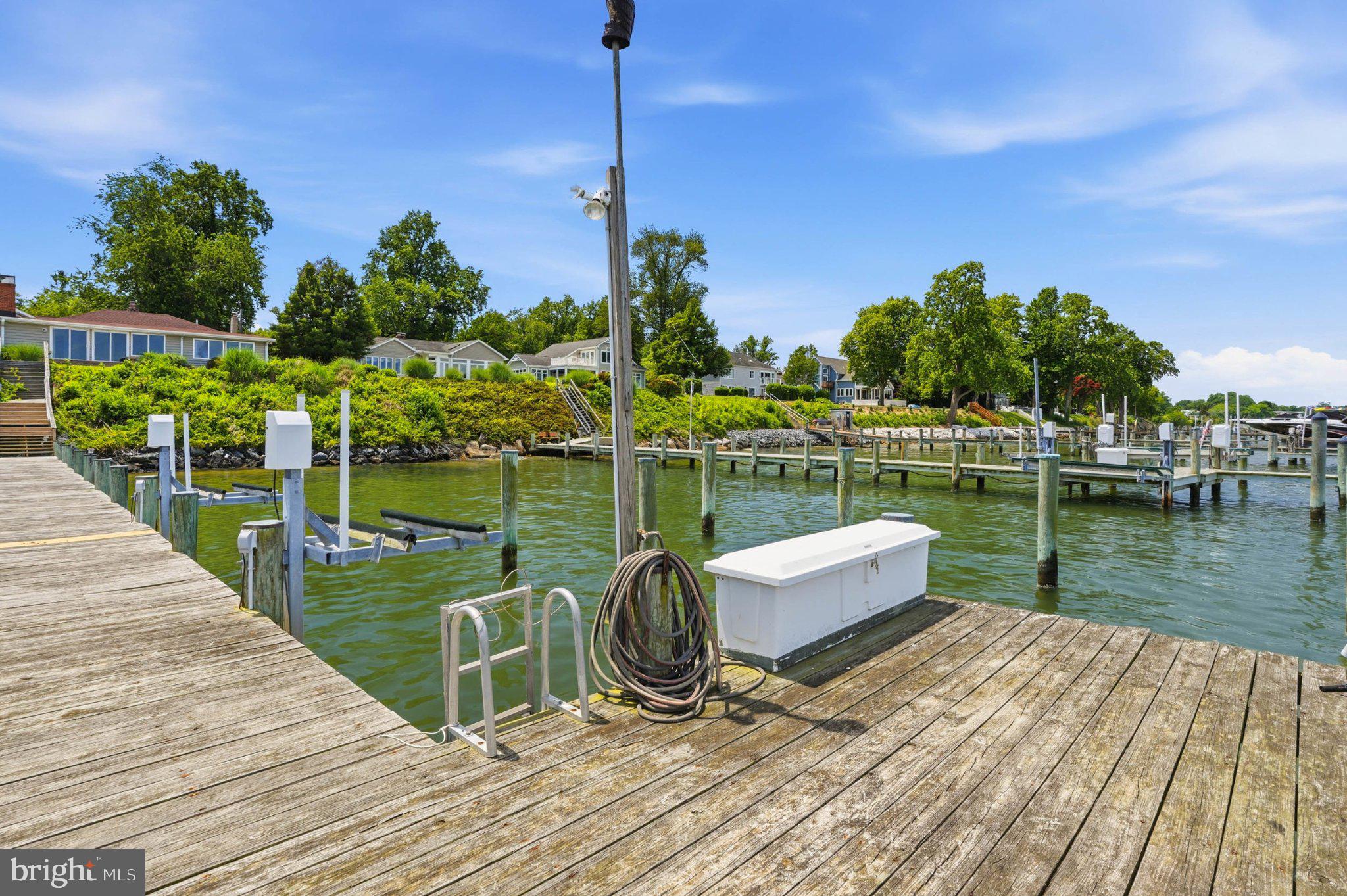 1100 River Bay Road Annapolis, MD 21409 - Photo 56 of 67 a view of a lake with a wooden deck