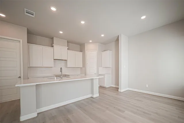 a view of kitchen with wooden floor