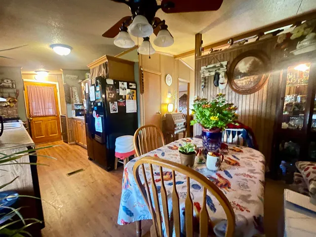 a dining room with furniture and a chandelier