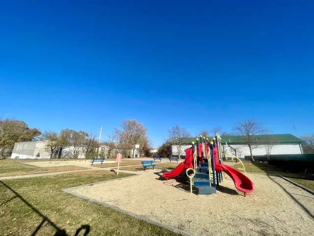a view of a swimming pool with an outdoor seating
