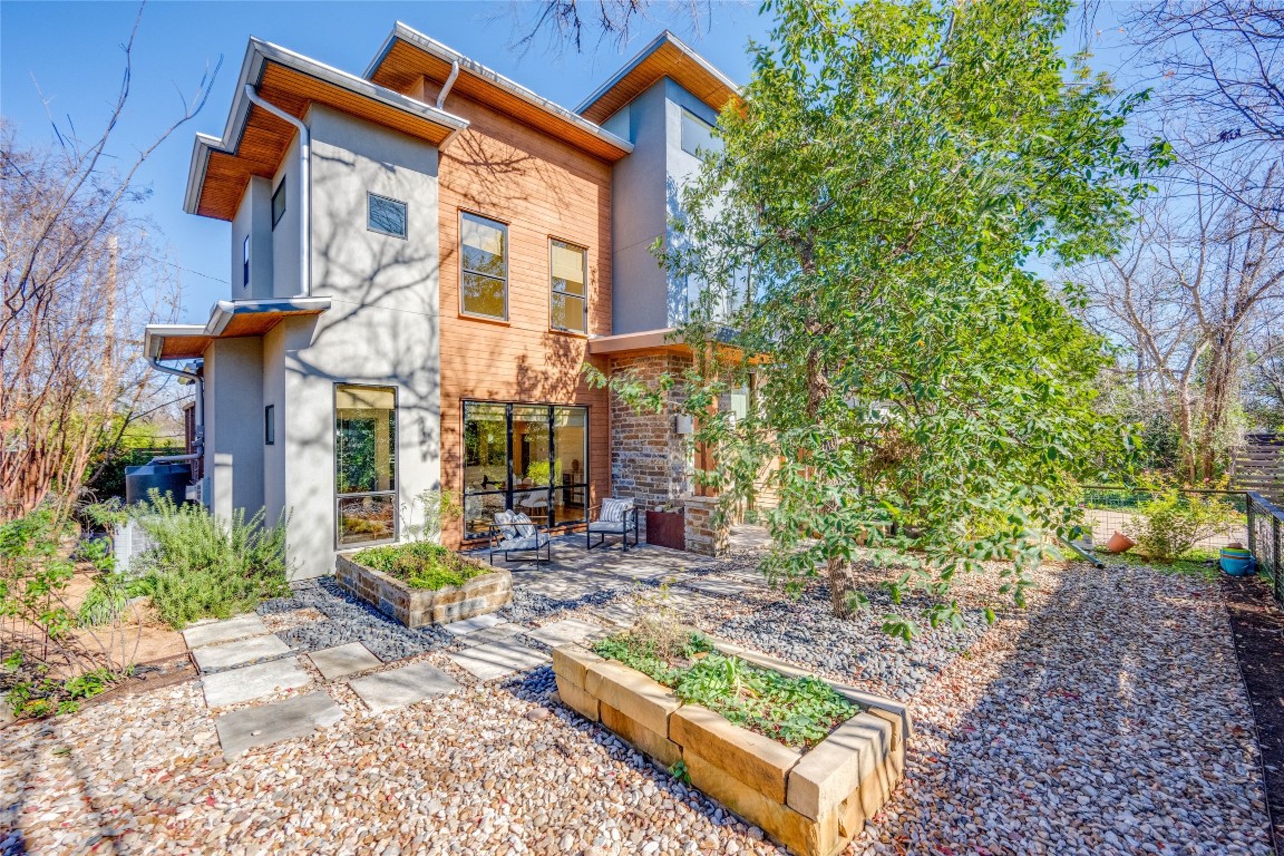 308 Terrace Drive, Unit A Austin, TX 78704 - Photo 1 of 1 a front view of a house with garden