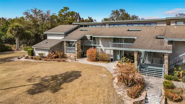 a front view of a house with a yard and a garage