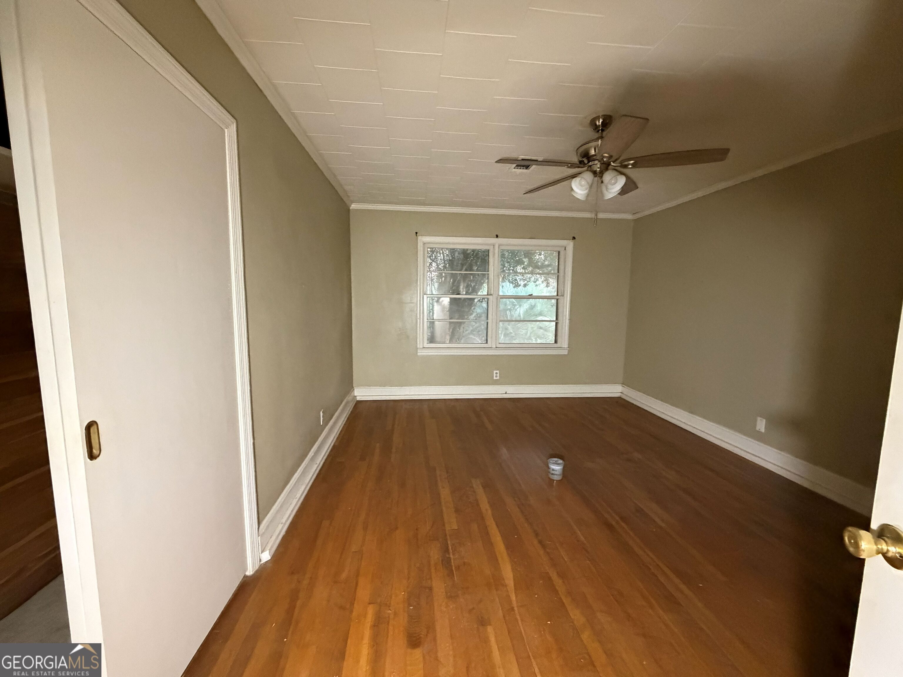 251 Dewey McGlamry Road Fitzgerald, GA 31750 - Photo 5 of 13 wooden floor in an empty room with a window