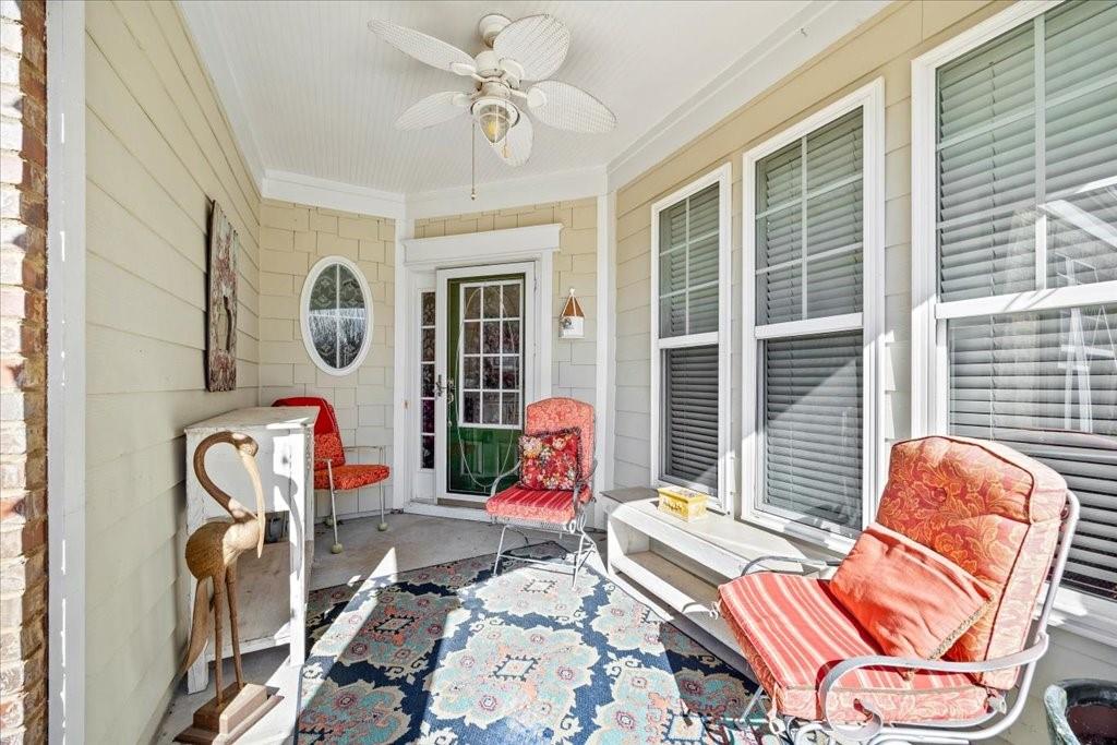 5015 Kings Common Way Cumming, GA 30040 - Photo 15 of 22 a bedroom with furniture and windows