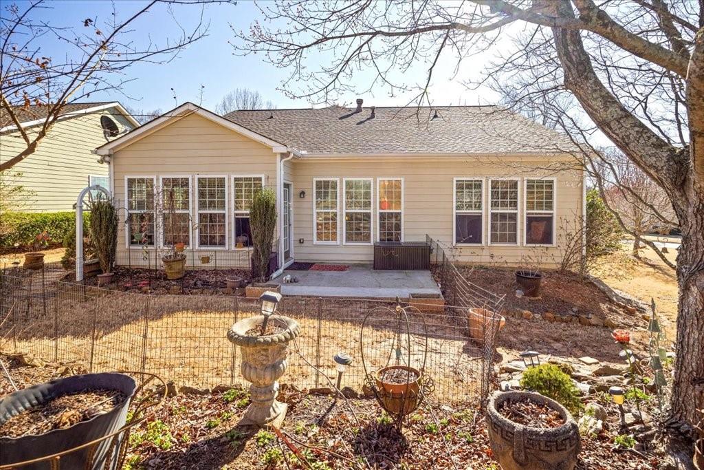 5015 Kings Common Way Cumming, GA 30040 - Photo 18 of 22 a front view of a house with a yard