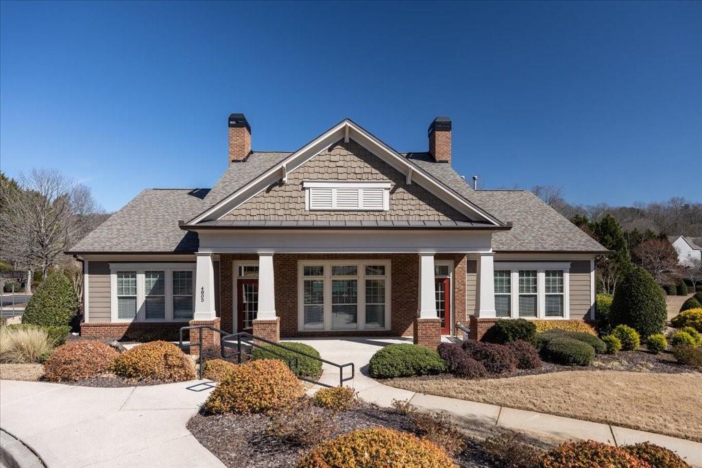 5015 Kings Common Way Cumming, GA 30040 - Photo 19 of 22 a front view of a house with a yard