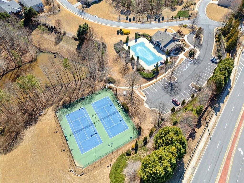 5015 Kings Common Way Cumming, GA 30040 - Photo 22 of 22 an aerial view of a house with a yard and garden