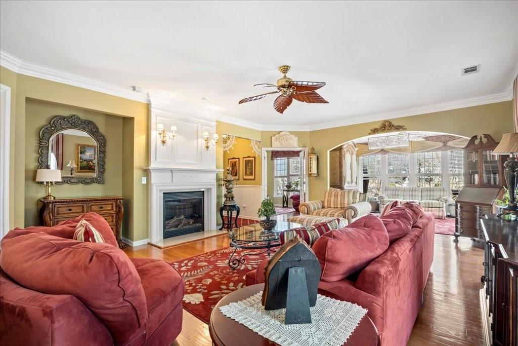 5015 Kings Common Way Cumming, GA 30040 - Photo 5 of 22 a living room with furniture fireplace and window