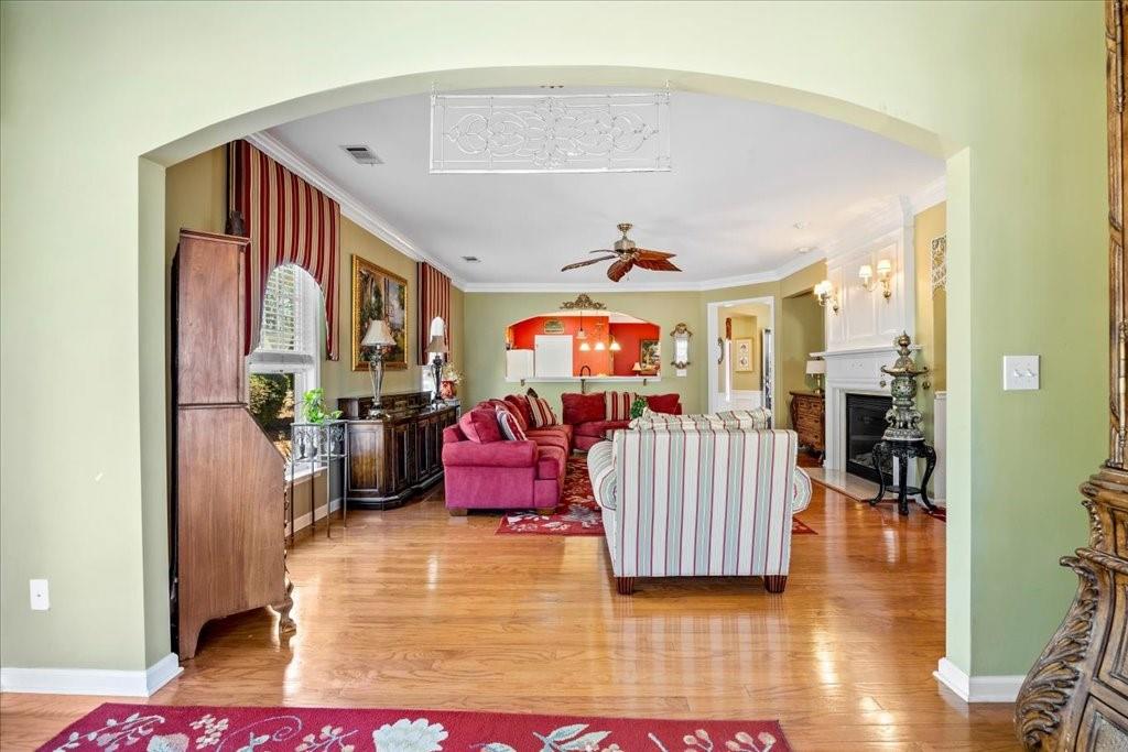 5015 Kings Common Way Cumming, GA 30040 - Photo 8 of 22 a living room with furniture and a flat screen tv