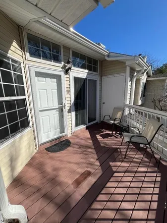 a front view of a house with lounge chair