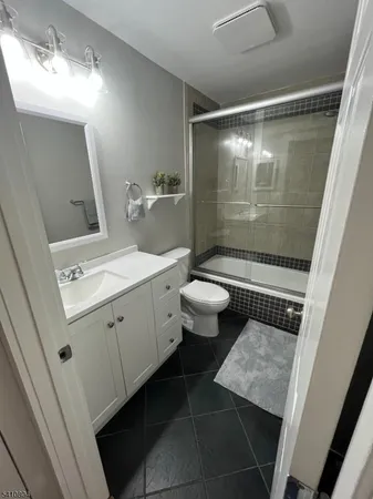 a bathroom with a sink and mirror