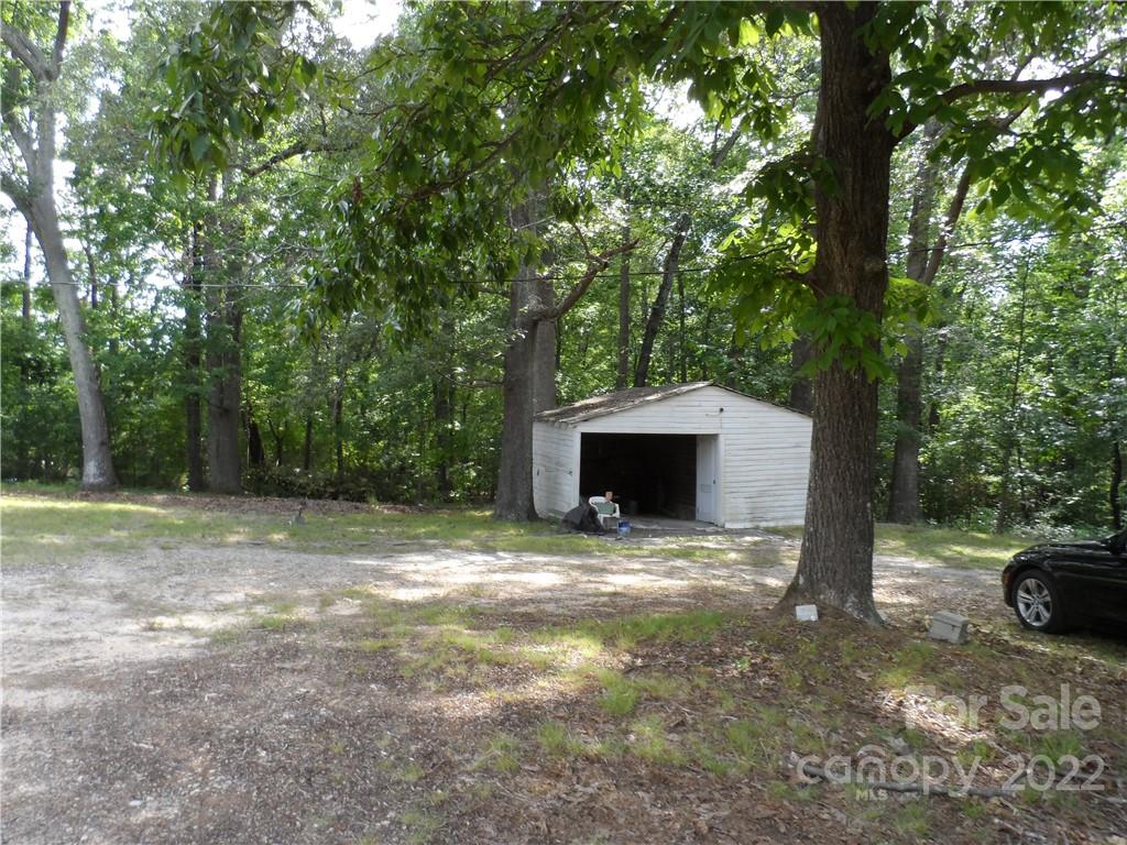 1184 Wilma Sigmon Road Lincolnton, NC 28092 - Photo 2 of 15 a view of backyard with trees