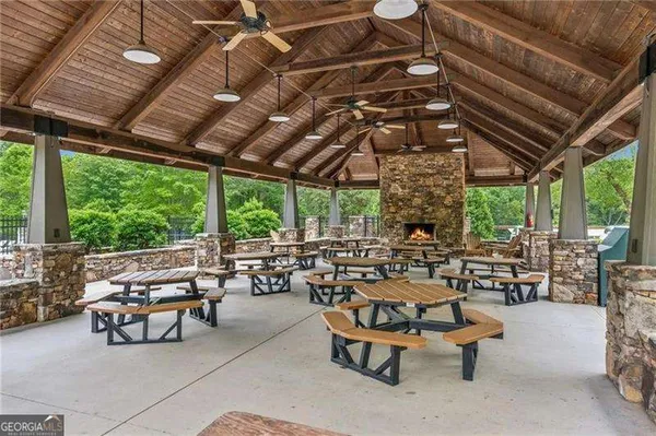 a building outdoor space with patio furniture and garden view