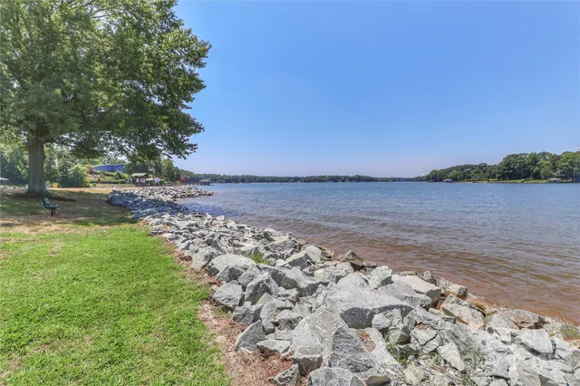 a view of a lake with a yard