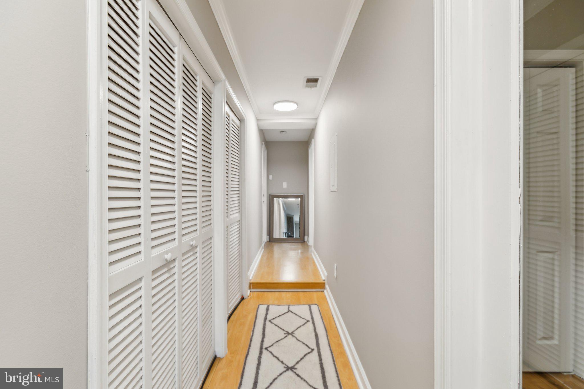 1710 West Virginia Avenue Northeast Washington, DC 20002 - Photo 12 of 36 a view of a hallway with wooden floor and a bathroom