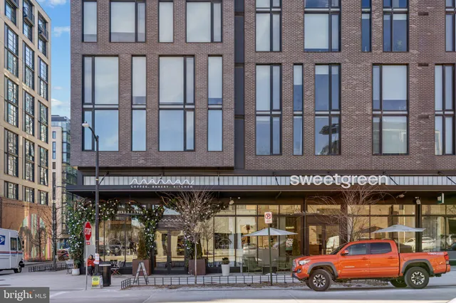 a front view of a building with parking