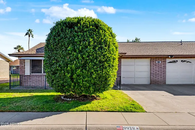 a house view with a garden space