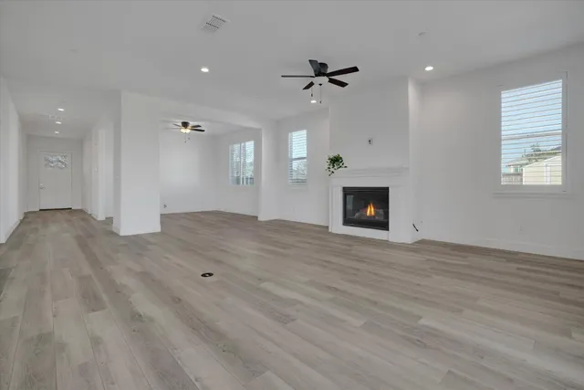 a kitchen with stainless steel appliances a sink a stove and cabinets
