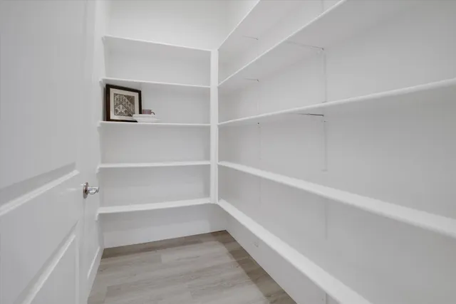 a large kitchen with a lot of counter space and cabinets