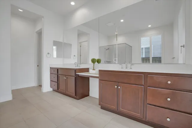 a view of a patio with table and chairs and wooden fence