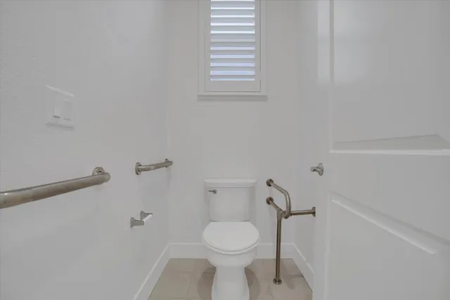 a view of a house with backyard sitting area and garden