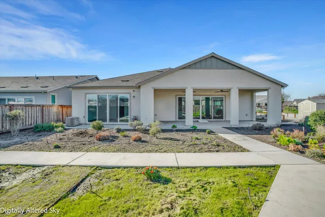 an aerial view of a house with a swimming pool