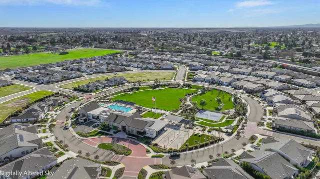 a house with swimming pool in front of it