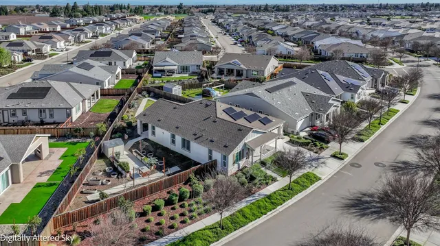 a view of a backyard with sitting area