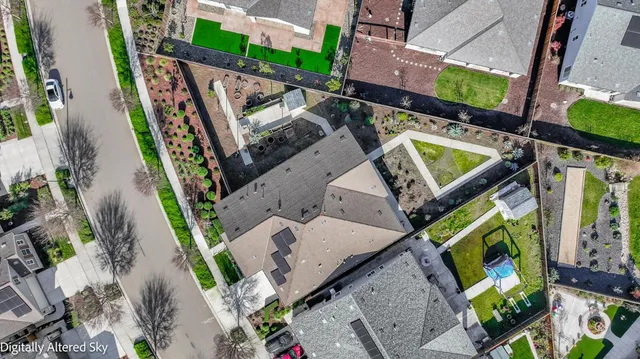 a view of a patio with couches table and chairs with wooden fence