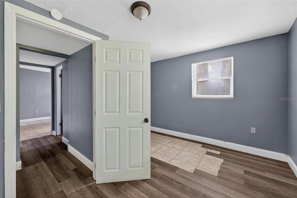 1257 North Pine Hills Road Orlando, FL 32808 - Photo 15 of 35 a view of entryway with wooden floor