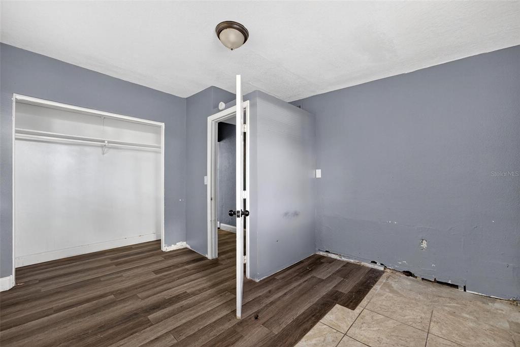 1257 North Pine Hills Road Orlando, FL 32808 - Photo 16 of 35 wooden floor in an empty room