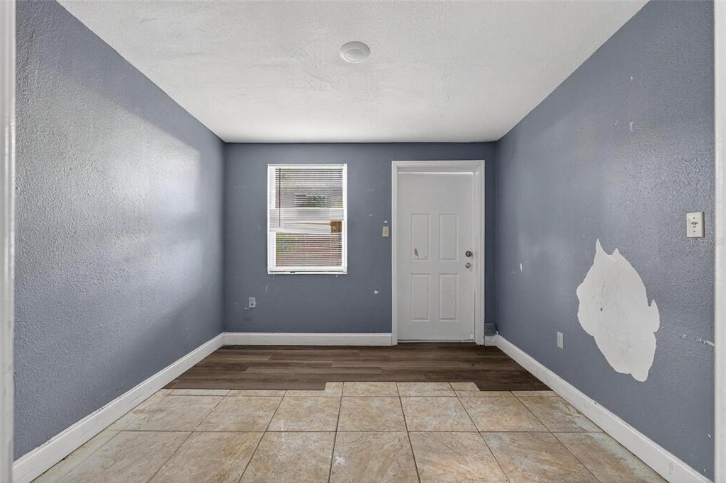 1257 North Pine Hills Road Orlando, FL 32808 - Photo 19 of 35 a view of a room with window and hardwood floor