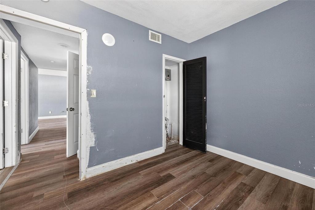 1257 North Pine Hills Road Orlando, FL 32808 - Photo 27 of 35 a view of a room with wooden floor