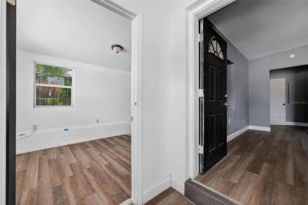 1257 North Pine Hills Road Orlando, FL 32808 - Photo 28 of 35 wooden floor with a window