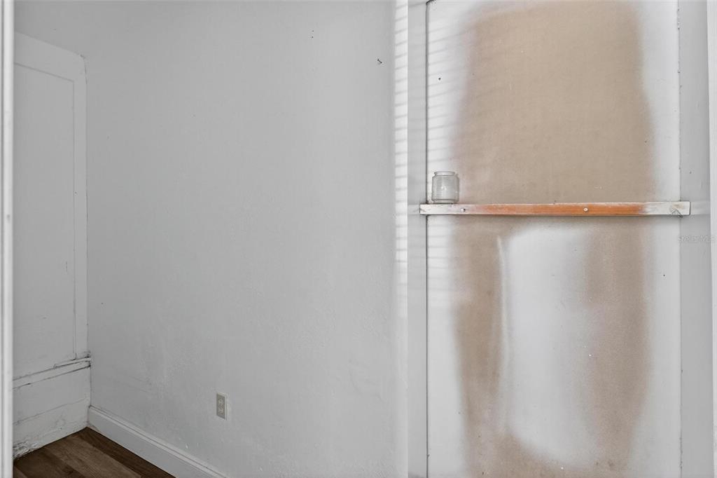 1257 North Pine Hills Road Orlando, FL 32808 - Photo 31 of 35 a view of an empty walk in closet