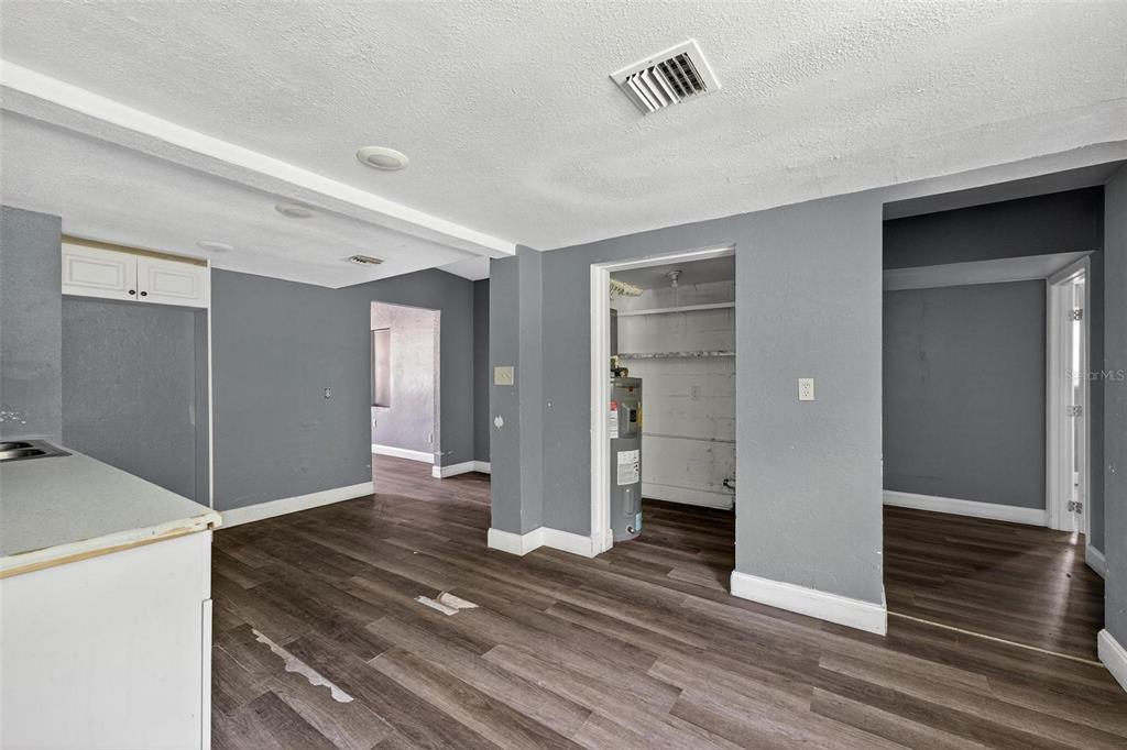 1257 North Pine Hills Road Orlando, FL 32808 - Photo 8 of 35 a view of livingroom with hardwood floor and hallway