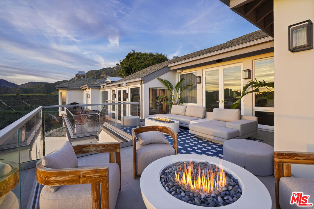 3140 Sweetwater Mesa Road Malibu, CA 90265 - Photo 50 of 71 a view of a swimming pool with a patio