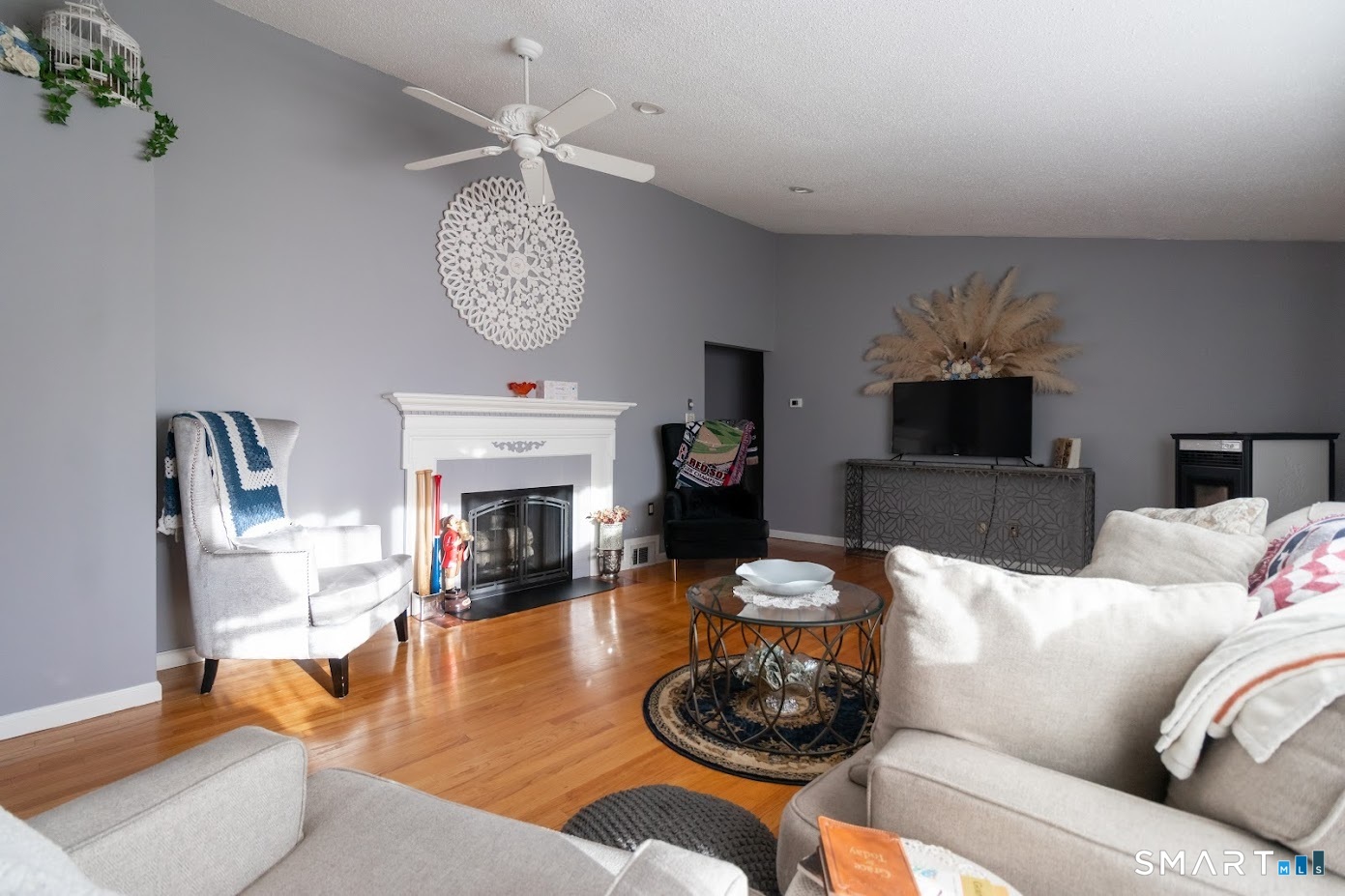 763 North Street Suffield, CT 06078 - Photo 18 of 40 a living room with furniture a fireplace and a chandelier